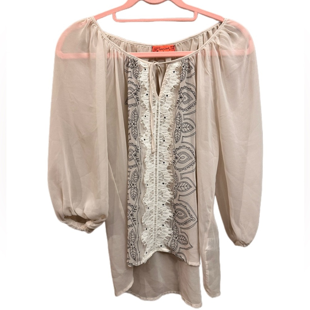 Live to be Spoiled. Cream colored Lace/detailed design on front of blouse